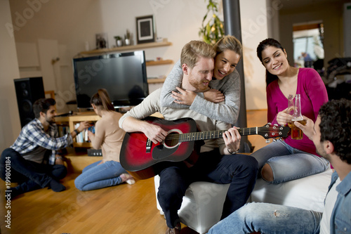 Friends having fun with guitar