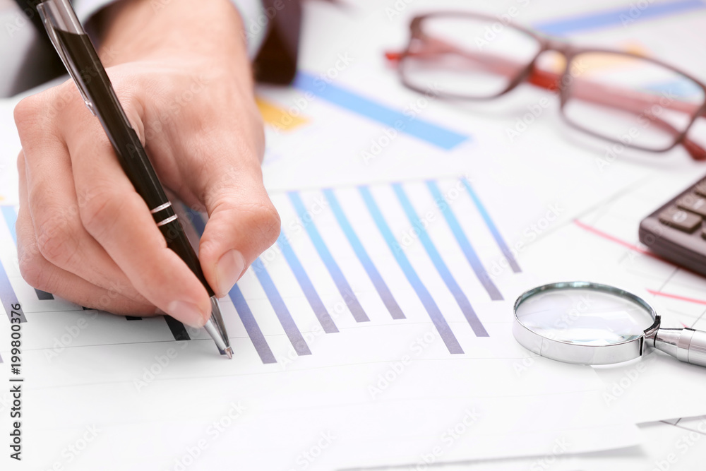 Man working with documents at table. Forex concept Man working with documents at table. Forex concept