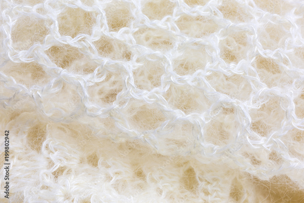 background of crocheted shawl in white mohair and silk wool