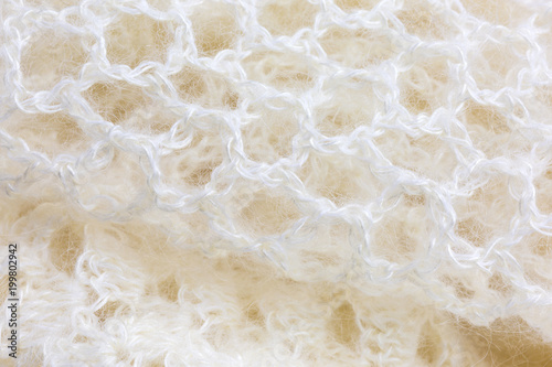 background of crocheted shawl in white mohair and silk wool