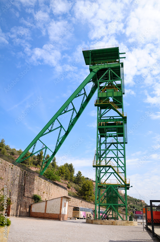 Green tower of a well extraction of a mine of salt. Cardona’s Salt Mountain Cultural Park. Cardona, Spain.