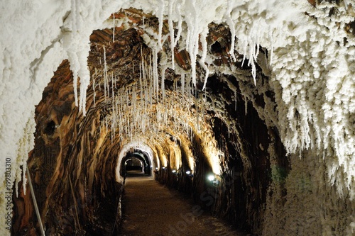 Salt cave in an old mine with white natural stalactites. Cardona’s Salt Mountain Cultural Park. Cardona, Spain.