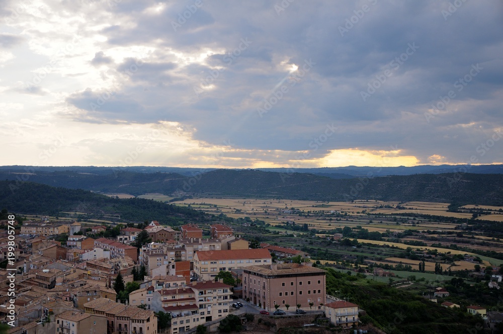 The sky is clouded over. The ray of the sun breaks through the cloud. View from Cardona Castle. Summer. Catalonia, Spain.