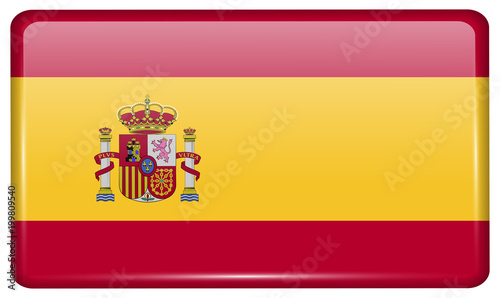 Flags Spain in the form of a magnet on refrigerator with reflections light.