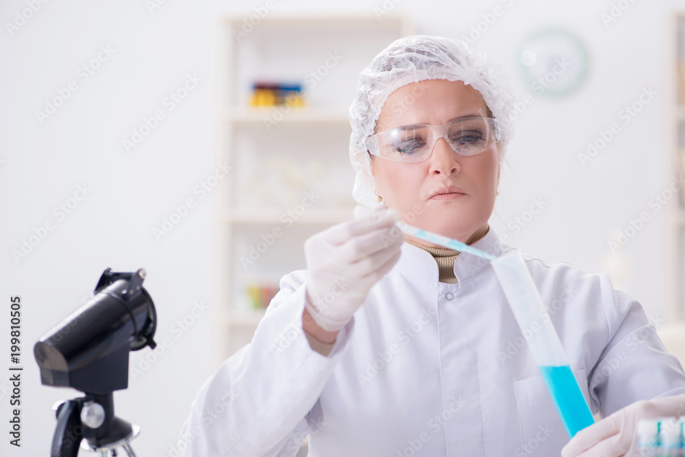 Woman chemist working in hospital clinic lab