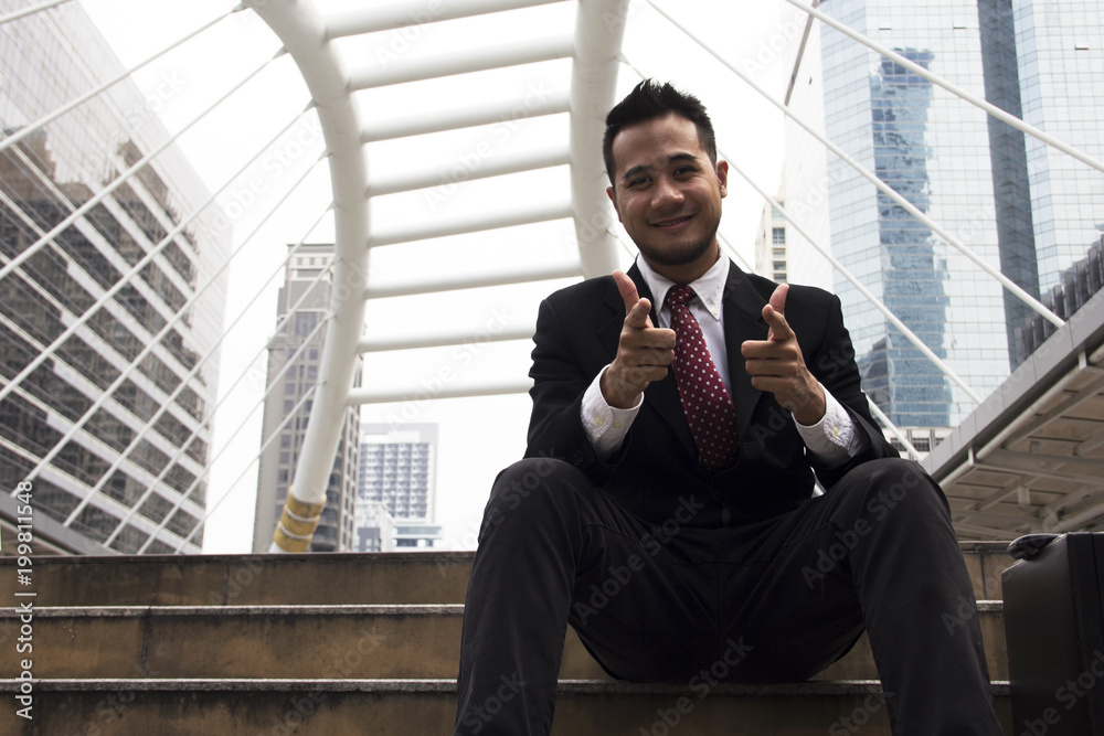 Business man sitting work on street and building background. Business man sitting work on street and building background.