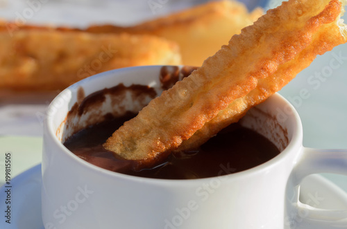 Typical Spanish snack churros are deep-fried pastries  and served with hot chocolate everywhere in Spain. Churros con chocolate is a classic Spanish breakfast