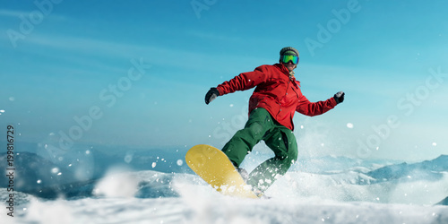 Snowboarder makes a jump, sportsman in action