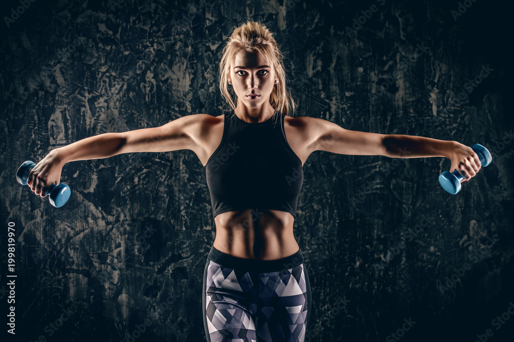 Obraz premium exercises with dumbbells
