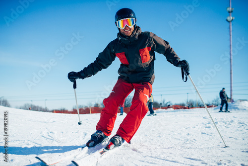 Skier riding from speed slope, front view