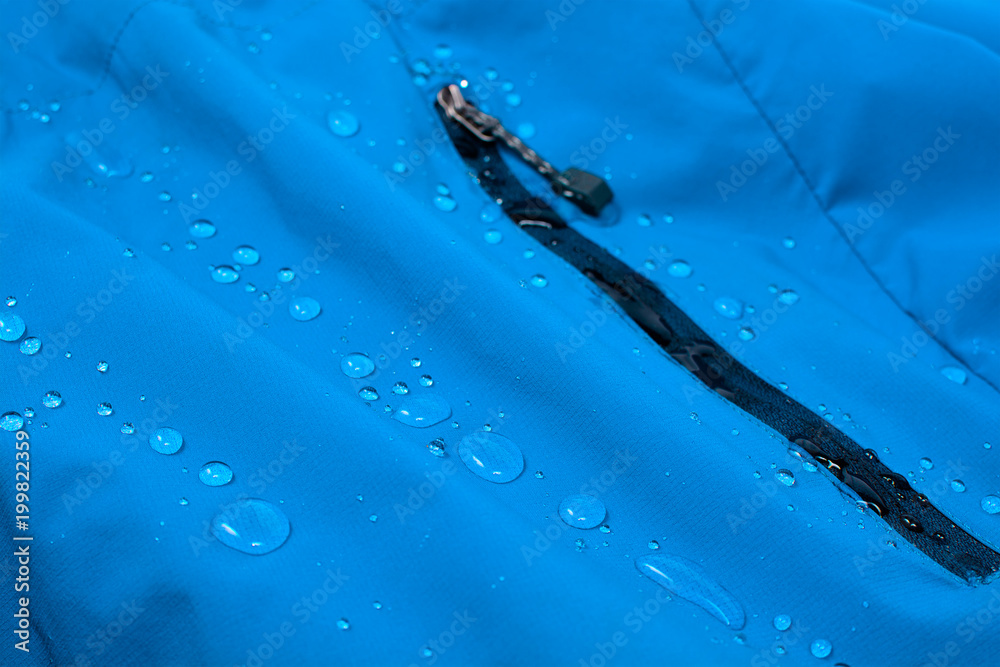 Water repellent coating durable repellency fabric outdoor shell jacket with water drops. Waterproof membrane with droplets.