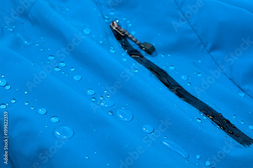 Obraz na płótnie Water repellent coating durable repellency fabric outdoor shell jacket with water drops. Waterproof membrane with droplets. w salonie