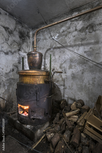 Home alcohol distillery for production drink from different kind of fruit on island Brac in Croatia photo