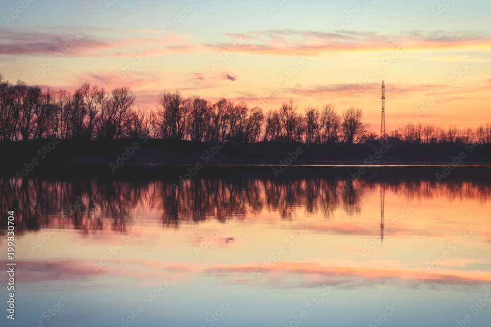 Coastline sunset reflection with power lines