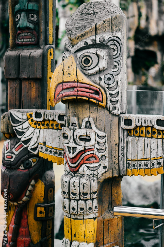 Traditional national indian totem. Totem pole sculpture art. Ancient wooden  mask. Mayan and aztecs symbolic religious gods faces. Ethnic pagan worship  and idolatry. Stock Photo | Adobe Stock
