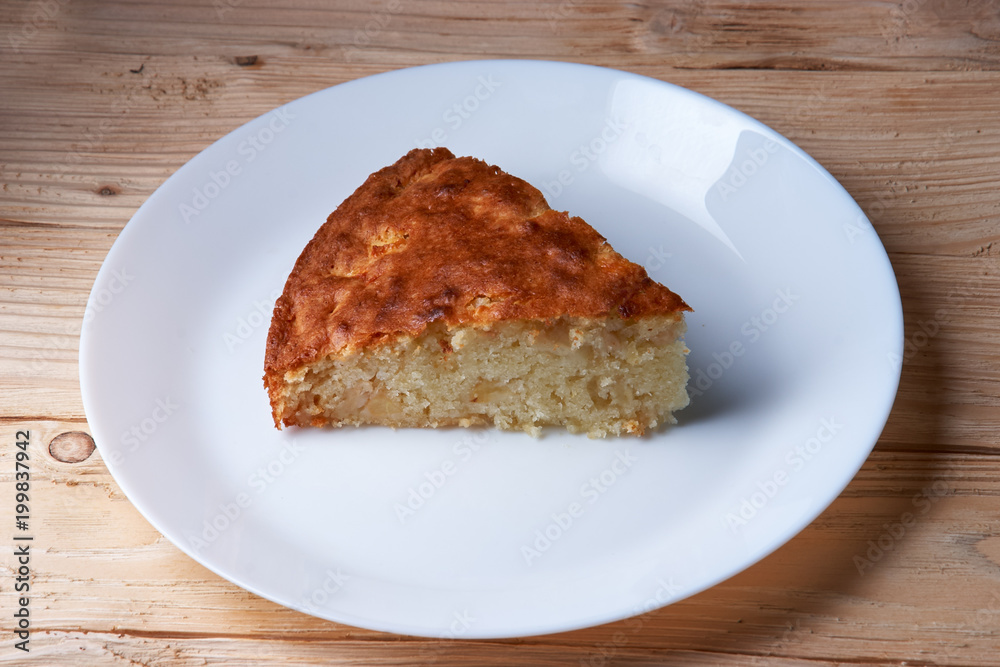Fresh Homemade Apple Pie with a Flakey Crust on white plate Fresh Homemade Apple Pie with a Flakey Crust on white plate