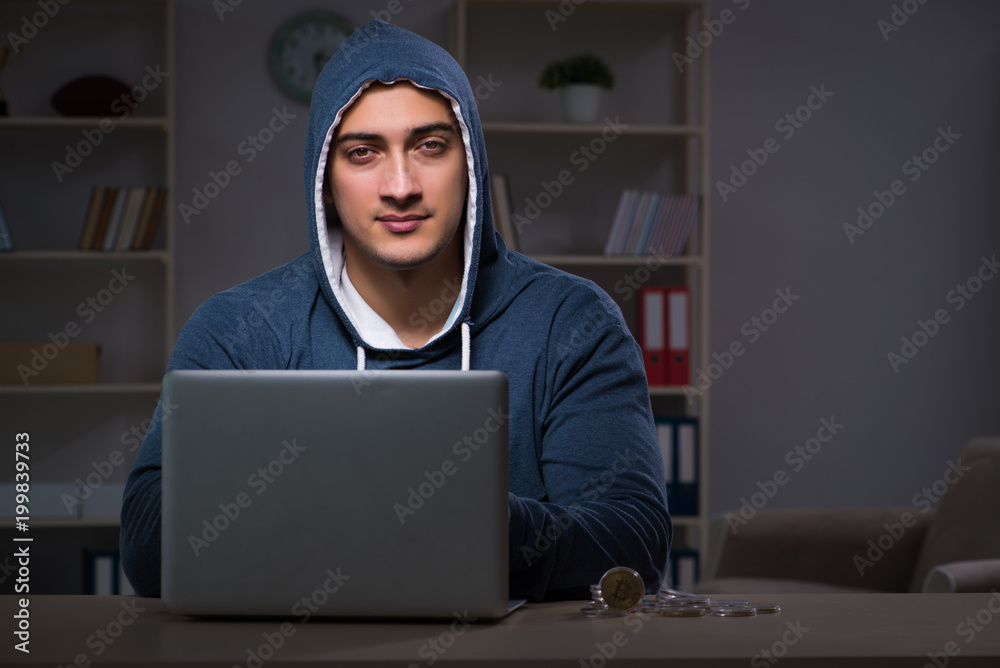 Hacker hacking the data late at night Hacker hacking the data late at night