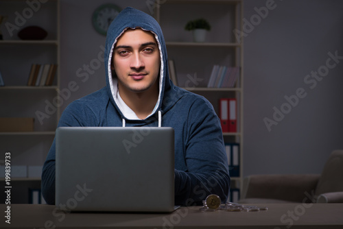 Hacker hacking the data late at night