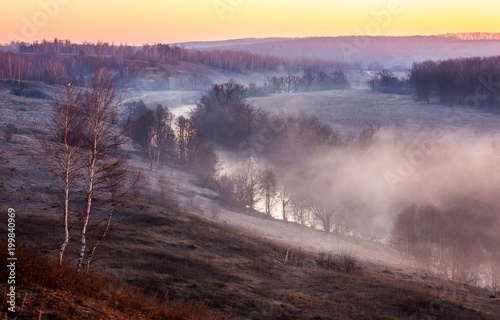 Sunrise through a river mist in the early spring