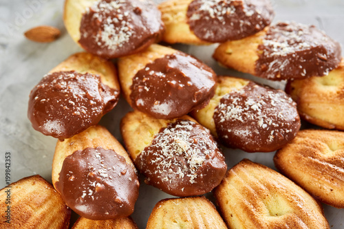 Tasty almond cookies arranged in the shape of fan on white background, close-up, selective focus