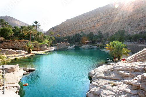 the beautiful glistering fresh water pool of Wadi Bani Khalid in Oman photo