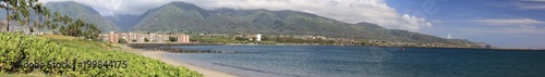 Kahului Harbor looking northeast with hotels,condos, and housing, with clouds covering the top of the volacno © Lawr