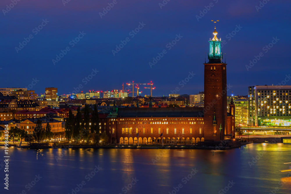 Fototapeta premium Sunset view onto City Hall, Stadshuset, in Kungsholmen island of Stockholm in Sweden