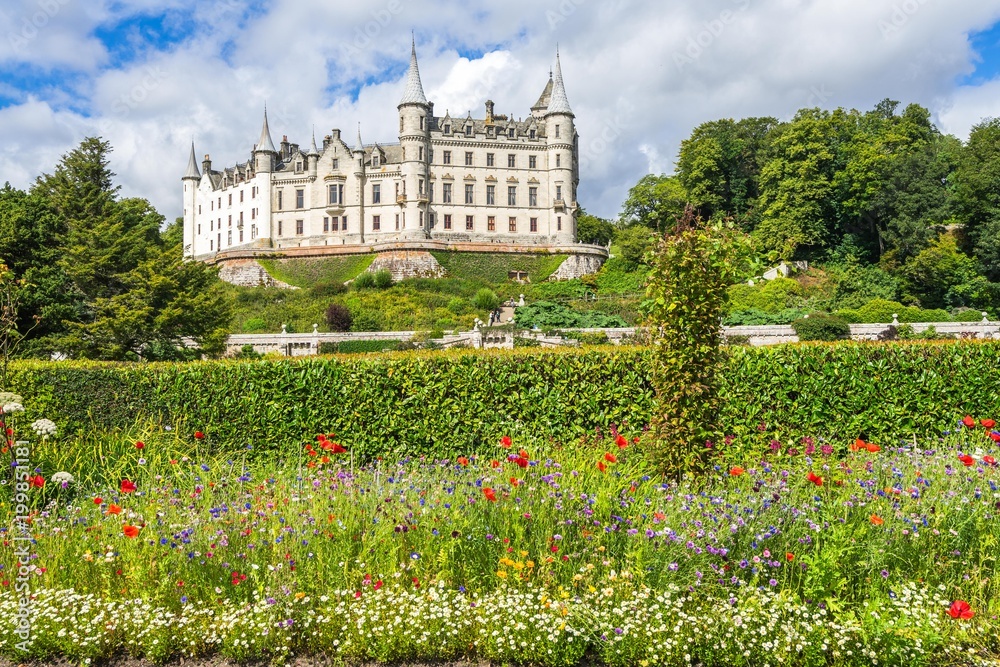 Hedge and flowers decorate the garden of Dunrobin Castle, Sutherland, Scotland, Britain