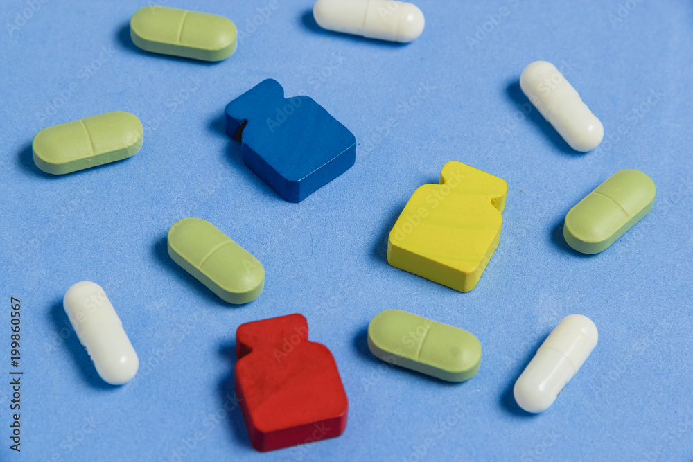 Assortment of Pills, Tablets and Capsules on Blue Table. Assortment of Pills, Tablets and Capsules on Blue Table.