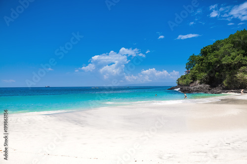 Tropical sandy beach and ocean with crystal water in Bali
