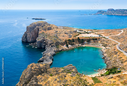 View of azure heart-shaped bay from the Acropolis of Lindos, Rhodes, Dodecanese, Greek Islands, Greece, Europe