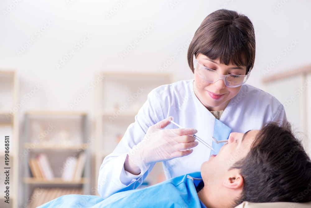 Patient visiting dentist for regular check-up and filling Patient visiting dentist for regular check-up and filling