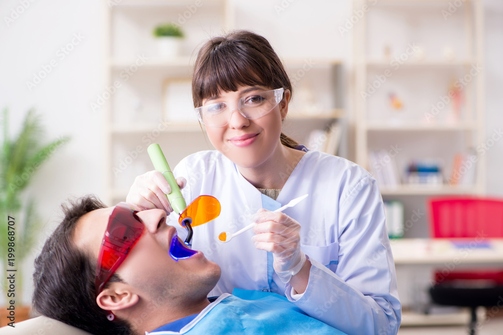 Patient visiting dentist for regular check-up and filling Patient visiting dentist for regular check-up and filling