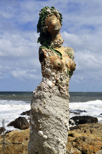 Mermaid sculpture in the sea