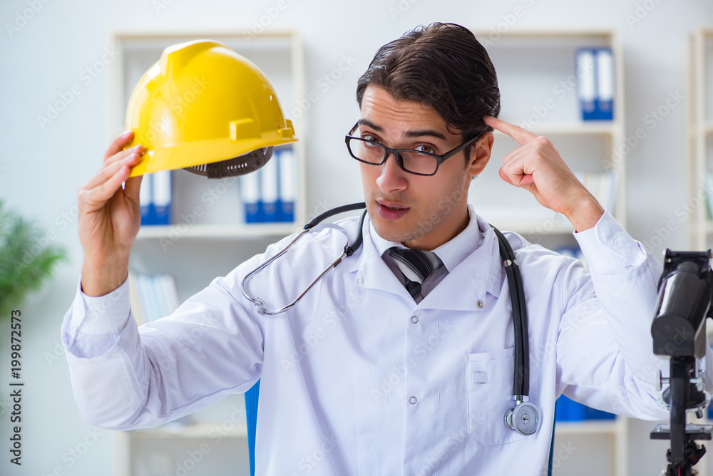 Safety doctor advising about wearing hard hat Safety doctor advising about wearing hard hat