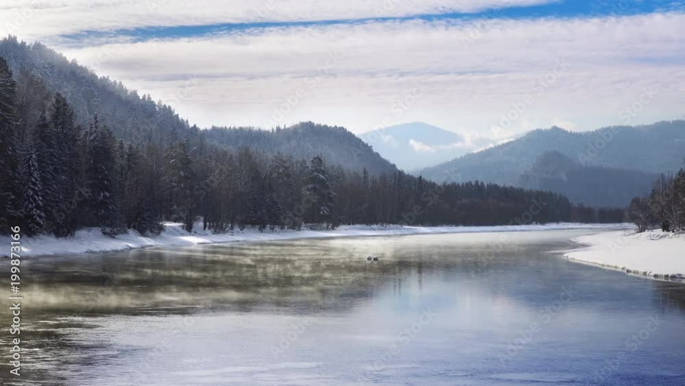 Mist above the Snowy Mountain River in Winter Morning. Altay, Siberia. Mist above the Snowy Mountain River in Winter Morning. Altay, Siberia.