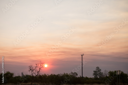 Smokey sunset near Tenant Creek in the outback of the Northern Territory in Australia