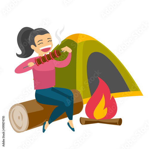 Caucasian white woman enjoying camping picnic and roasting shashlik over the campfire in nature on the background of tent