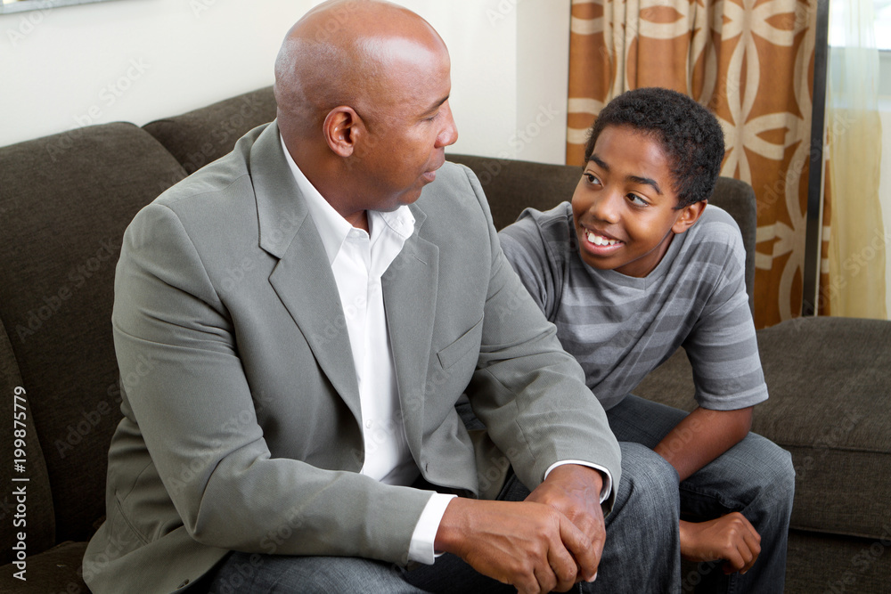 African American father and son. African American father and son.