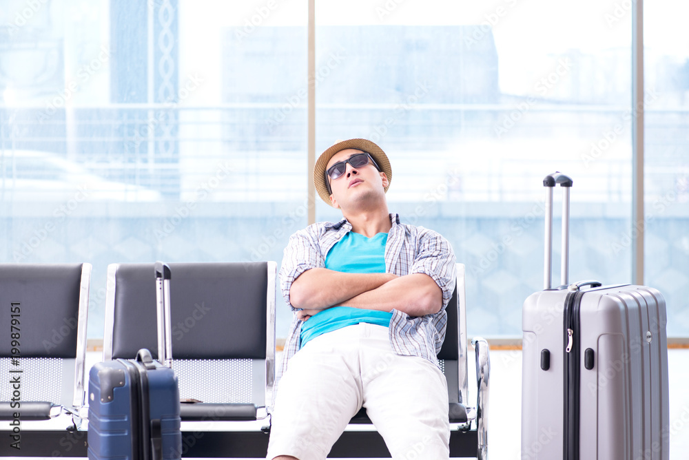 Young man travelling for his summer beach vacation Young man travelling for his summer beach vacation