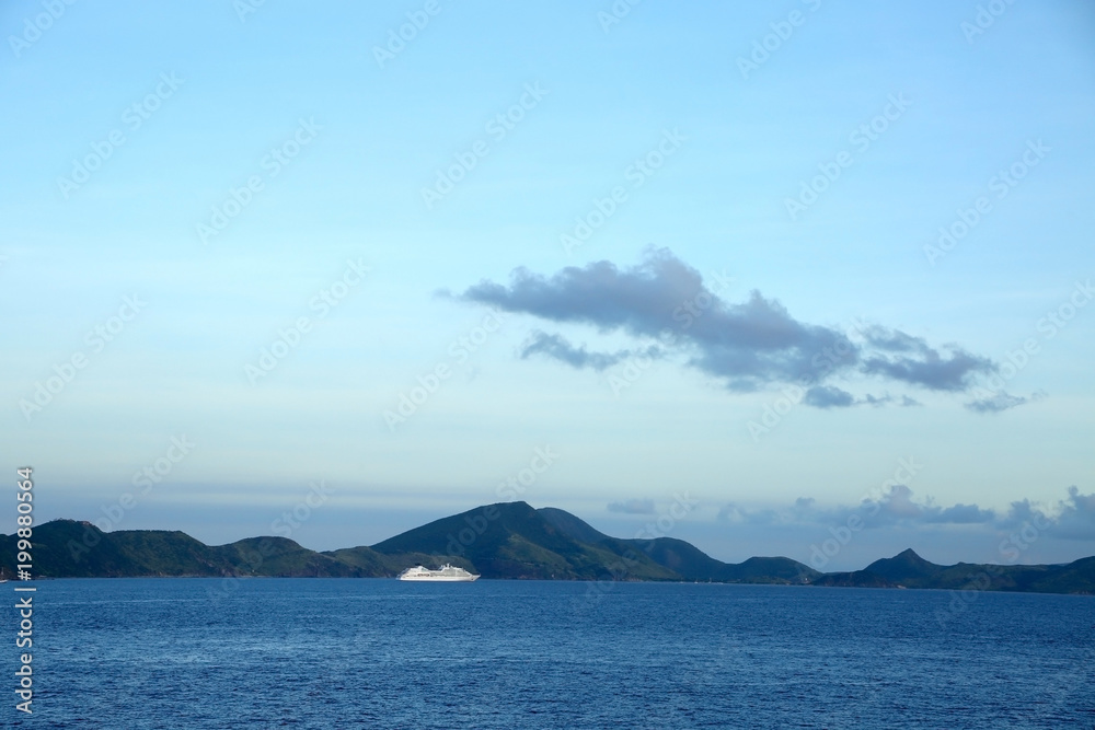 Cruise ship anchored off the coast of Basse Terre, St Kitts, Caribbean with copy space.
