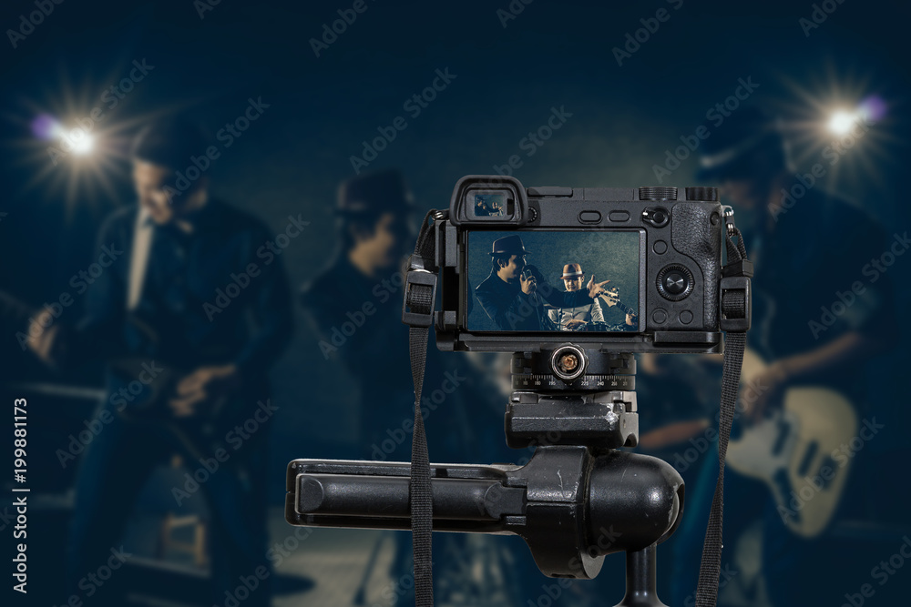 Professional digital Mirrorless camera with microphone recording video blog of Musician band singing a song and playing music instrument,Camera for photographer or Video and Live Streaming concept Professional digital Mirrorless camera with microphone recording video blog of Musician band singing a song and playing music instrument,Camera for photographer or Video and Live Streaming concept