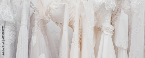 Fotografia Banner White modern wedding dresses in dress store.