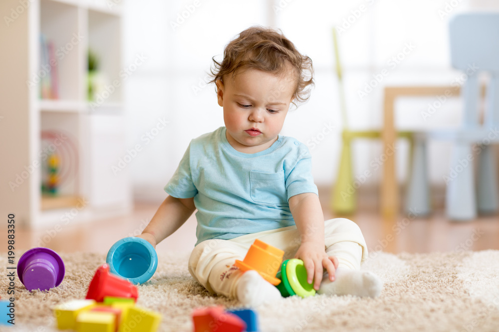 baby kid toddler playing toys at home or nursery baby kid toddler playing toys at home or nursery