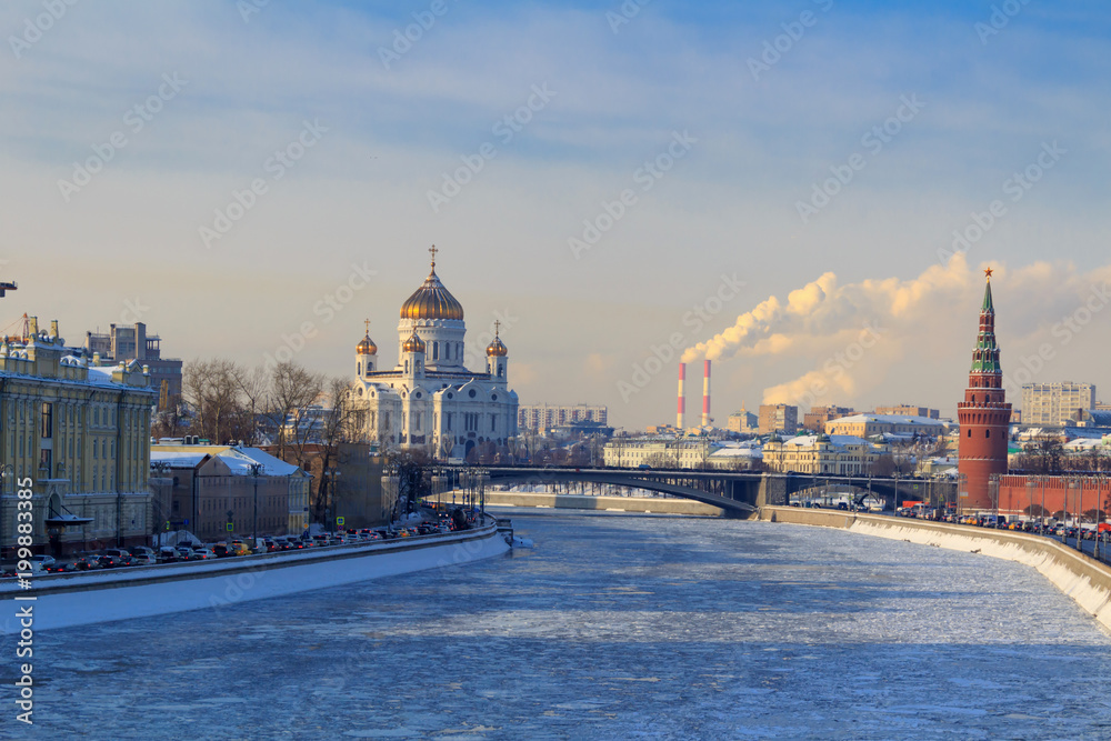 View of frozen Moskva river near the Moscow Kremlin in sunny winter day