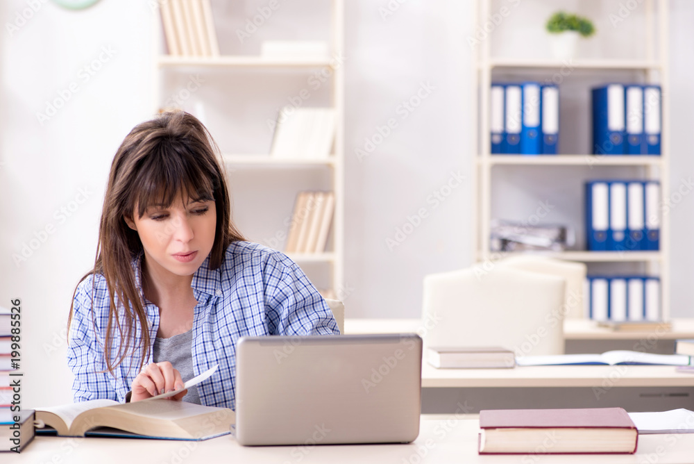 Young female student in educational concept Young female student in educational concept