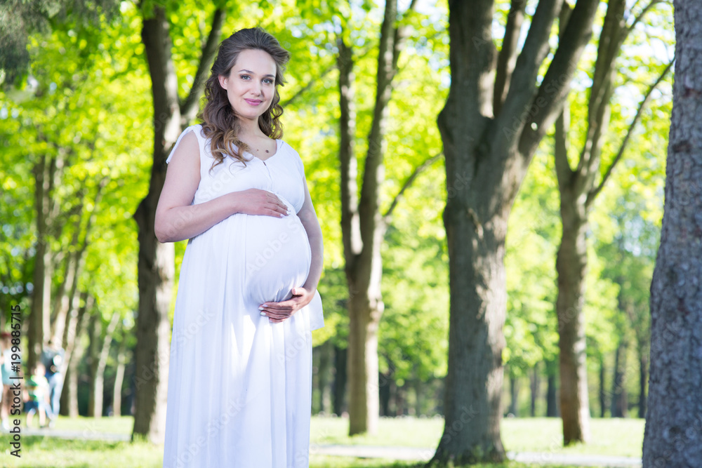 Pregnant woman in a spring park Pregnant woman in a spring park