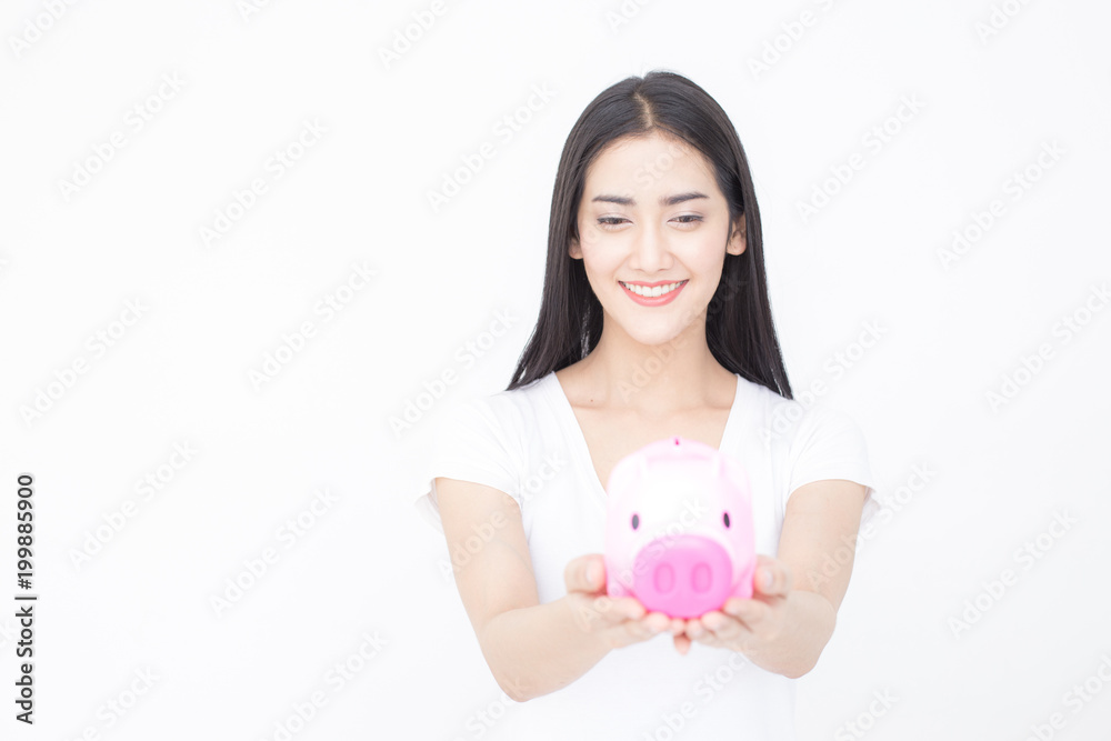 Portrait of Attractive female holding piggy bank on white background. Portrait of Attractive female holding piggy bank on white background.