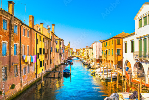 Chioggia town in venetian lagoon, water canal and church. Veneto, Italy © stevanzz