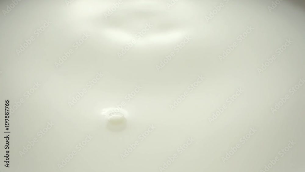 milk dropping and splashing in slow motion milk dropping and splashing in slow motion